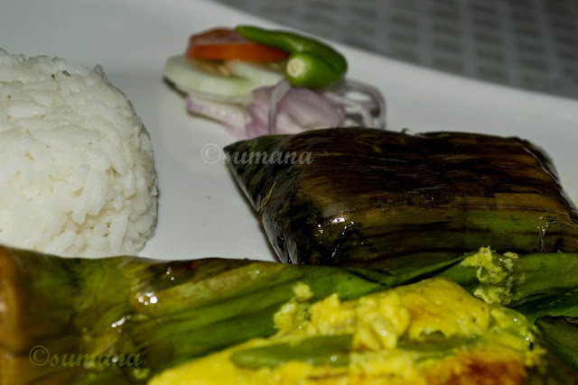Bhetki macher paturi, baked fish wrapped in banana leaf