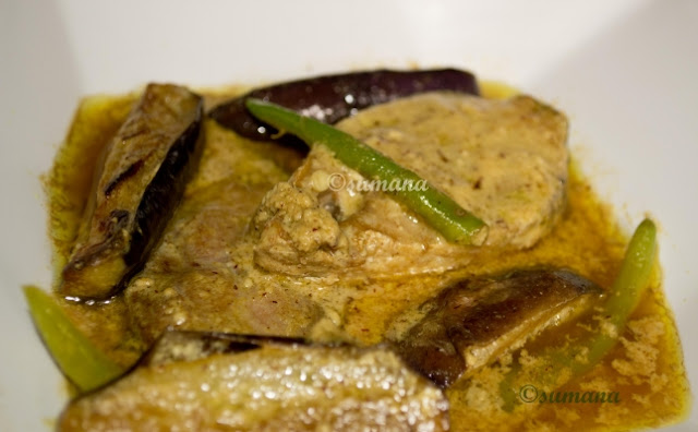 Hilsa fish cooked with butter egg plant and mustard